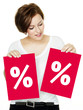 Photo: Woman shows discount on two red boards Woman shows discount on two red boards
