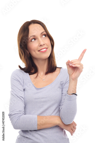 Photo: Attractive young woman pointing Attractive young woman pointing