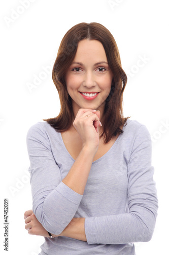 Photo: Casual young woman smiling Casual young woman smiling