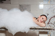 Young woman having massage in hamam.