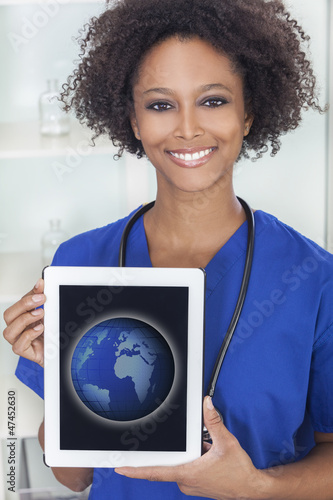 Photo: African American Female Doctor Tablet Computer World Map African American Female Doctor Tablet Computer World Map