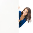 Beautiful young woman showing blank signboard