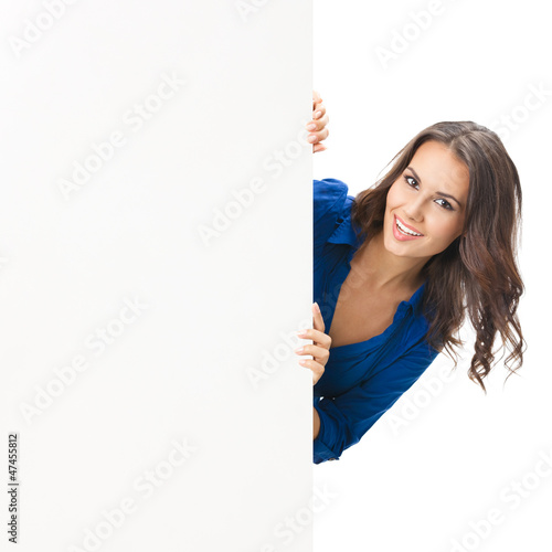 Photo: Beautiful young woman showing blank signboard Beautiful young woman showing blank signboard