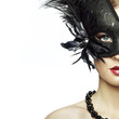 Beautiful young woman in black mysterious venetian mask