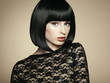 Fashion portrait of a young beautiful dark-haired woman