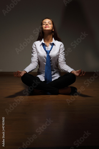 Photo: Business woman meditating Business woman meditating