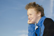 Portrait of youngster against blue sky