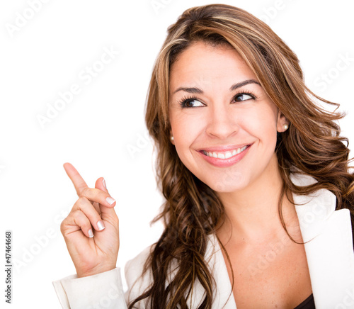 Photo: Business woman pointing an idea Business woman pointing an idea