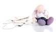 Photo: Wooden puppet sitting isolated on white Wooden puppet sitting isolated on white