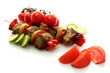 tasty grilled meat and vegetables on skewers, isolated on white