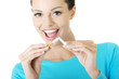 Young woman with broken cigarette. Stop smoking concept.