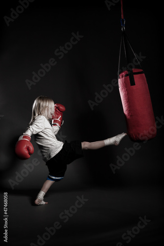 Photo: kicking kid kicking kid