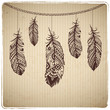 Ethnic feather heart on the cardboard background