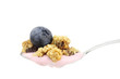 Spoonful of yogurt, muesli and blueberry isolated on white