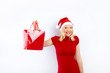 beautiful blonde woman holding a christmas gift is smiling