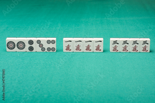 Photo: Smooth table surface with a mahjong on it Smooth table surface with a mahjong on it