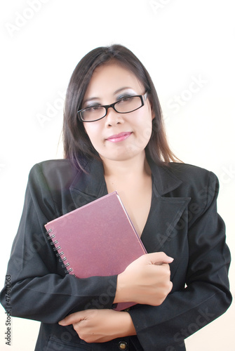 Photo: Business Lady holding her notebook. Business Lady holding her notebook.
