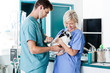 Vet Measuring Rabbit's Pulse