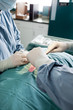 Close-Up Of Veterinarian Doctor And Female Assistant Performing