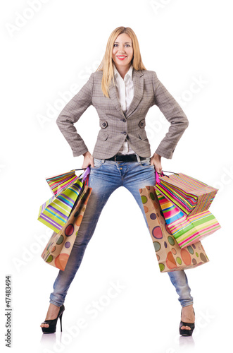 Photo: Attractive woman after christmas shopping on white Attractive woman after christmas shopping on white