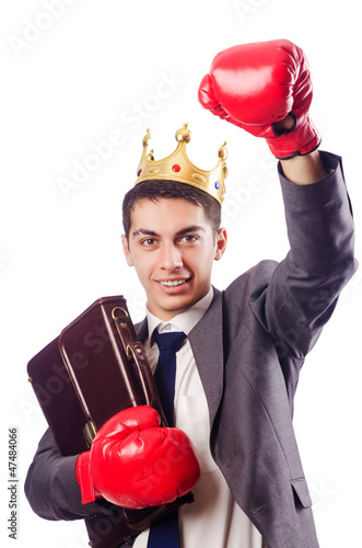 Photo: Handsome businessman with boxing gloves Handsome businessman with boxing gloves