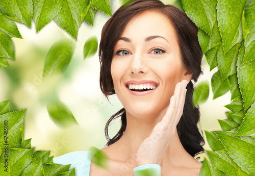 Photo: beautiful woman with green leaves beautiful woman with green leaves
