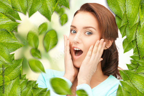 Photo: beautiful woman with green leaves beautiful woman with green leaves