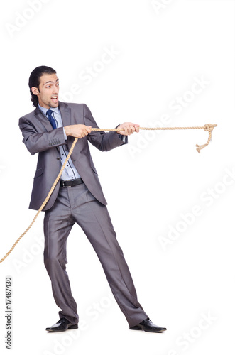 Photo: Businessman pulling rope on white Businessman pulling rope on white