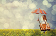 Photo: Redhead enchantress with umbrella and suitcase at spring rapesee Redhead enchantress with umbrella and suitcase at spring rapesee