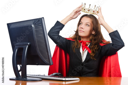 Photo: Superwoman worker with crown working in office Superwoman worker with crown working in office