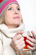 Mid age Woman With Hot tea Wearing Winter Clothes