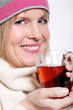 Mid age Woman With Hot tea Wearing Winter Clothes