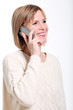 Caucasian middle aged woman talking by cellphone smiling