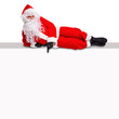 Santa lying on a blank billboard sign