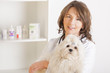 Photo: Woman vet holding a dog Woman vet holding a dog