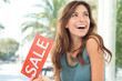 Happy Woman Holding Sale Sign