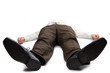 Young businessman lying on the floor