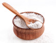 Photo: Sea Salt in a spoon and bowl isolated on white background Sea Salt in a spoon and bowl isolated on white background