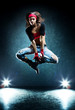 Young woman dancer jumping