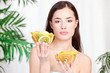 Photo: woman holding bowls full of fruit woman holding bowls full of fruit