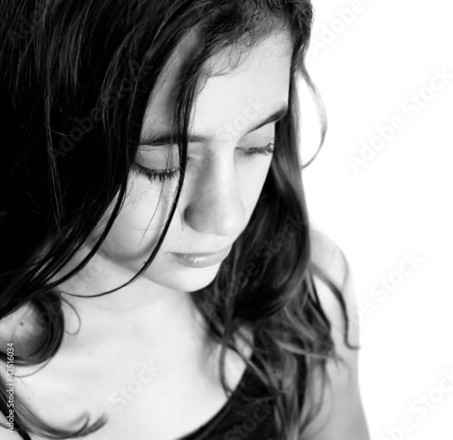 Photo: Black and white portrait of a sad hispanic girl Black and white portrait of a sad hispanic girl