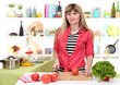 Photo: Beautiful girl in kitchen while cooking Beautiful girl in kitchen while cooking