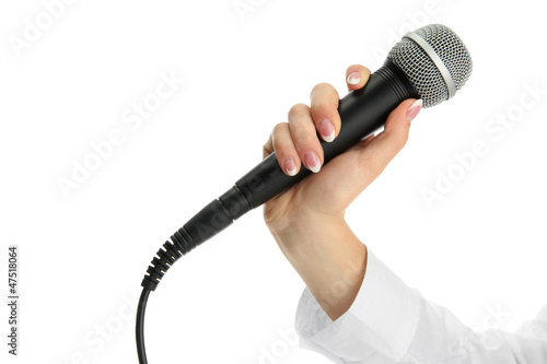 Photo: female hand with microphone isolated on white female hand with microphone isolated on white
