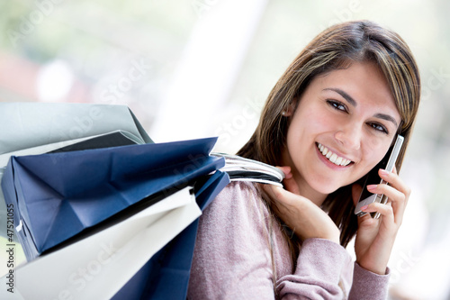 Photo: Shopping woman on the phone Shopping woman on the phone