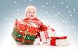 Photo: santa helper baby with christmas gifts santa helper baby with christmas gifts