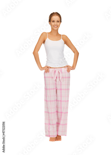 Photo: happy and smiling woman in cotton pajamas happy and smiling woman in cotton pajamas