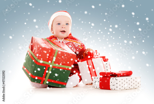 Photo: santa helper baby with christmas gifts santa helper baby with christmas gifts
