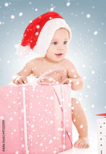 Photo: santa helper baby with christmas gifts santa helper baby with christmas gifts