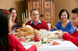 Multi Generation Family Celebrating With Christmas Meal
