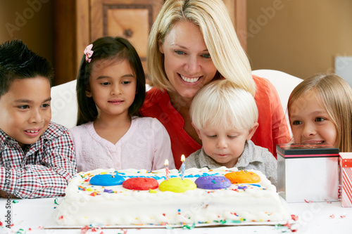 Photo: Mother Celebrating Child's Birthday With Friends Mother Celebrating Child's Birthday With Friends